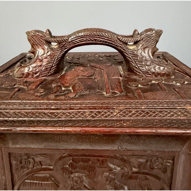 A complete traveling mahjong set housed in a hand-carved wood case, likely made in China for export during the early 20th-...