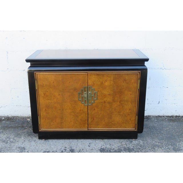 This Buffet is made of wood, solid wood, burlwood, veneer, and metal. This Buffet is an excellent example of the Hollywood...