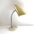 A vintage, mid-century modern working gold metal gooseneck desk or table lamp with a round base, adjustable neck, and...