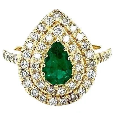 1.38 Carat Colombian Emerald Double Halo Diamond Yellow Gold Ring Item Specs: Pear Cut Colombian Emerald = 0.56 Carats 47...