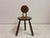 A sculptural French side chair in solid oak, in the manner of Charles Dudouyt, dating to the mid-20th century. The design...