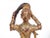 Antique carved wooden sculpture depicting Vasundharā the Thai goddess. She is depicted wringing the cool waters of...