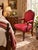 Elegant Ethan Allen carved wood armchair with a distinctly French-inspired silhouette, featuring a shaped upholstered...