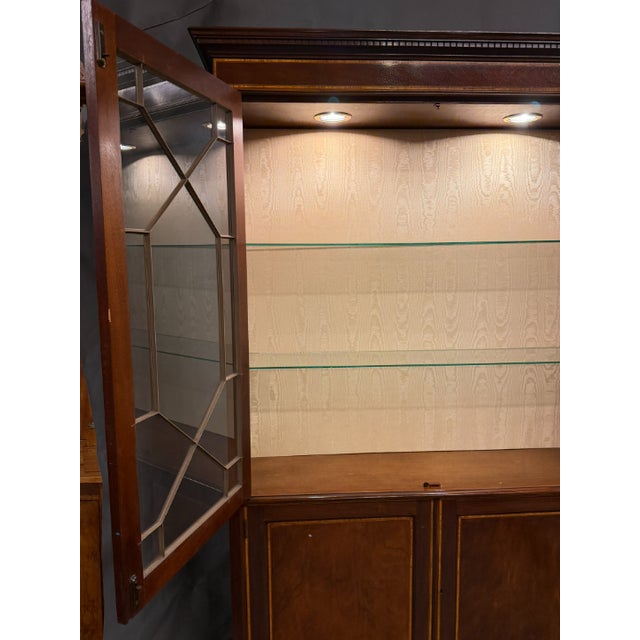 Late 20th century English Mahogany Bookcase. Chippendale style inlaid with satinwood, ebony, and tulipwood. Circa 1980....