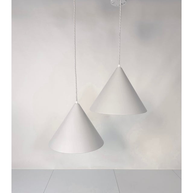 A pair of early edition model 'Billard-Pendel' hanging lamps. Its product name refers to the design concept which was...