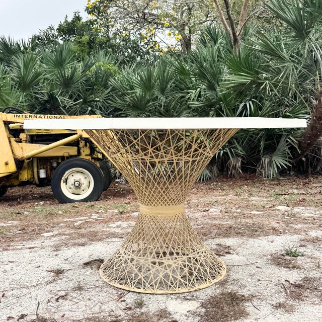 Distinctive Mid Century Modern dining table featuring a sculptural spun fiberglass pedestal base and an octagonal...