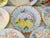 Lovely set of eight nicely matched vintage hand-painted porcelain plates each in a pastel shaded floral motif with gold...