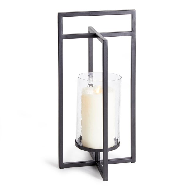 Mondrianinspired, simple geometric shapes with intersecting planes make for a contemporary look. This indoor lantern is...
