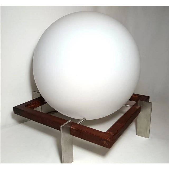 Manually crafted out of massive Stainless Steel blades, brown tainted beech wood, adorned with a 40cm diameter Opaline...