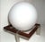 Manually crafted out of massive Stainless Steel blades, brown tainted beech wood, adorned with a 40cm diameter Opaline...