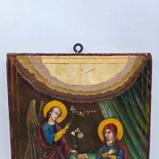 A beautiful antique hand-painted Greek Orthodox icon depicting the Annunciation (Evangelismos), portraying the Archangel...