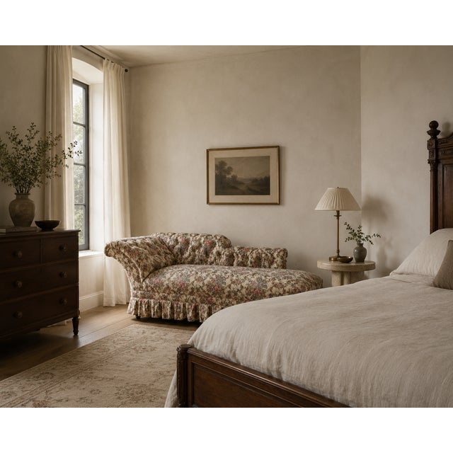 This 19th century Napoleon III antique chaise longue is defined by its sculptural silhouette — a scrolled, deeply button-...