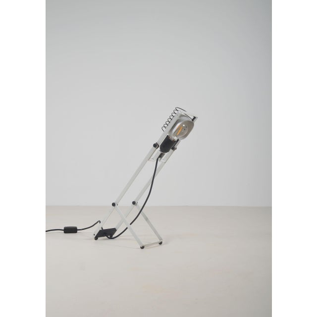 Designer table lamp from the Sintesi series, designed by Ernesto Gismondi in 1976. It was manufactured by the renowned...