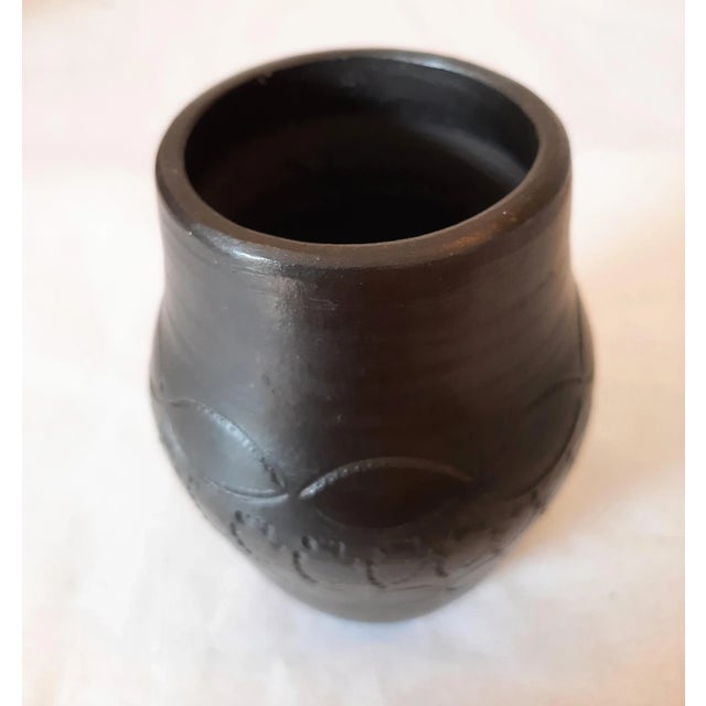 Traditional Cherokee black clay Pottery Vase Signed by Louise Bigmeat Maney beautifully designed. This 3.25" blackware...