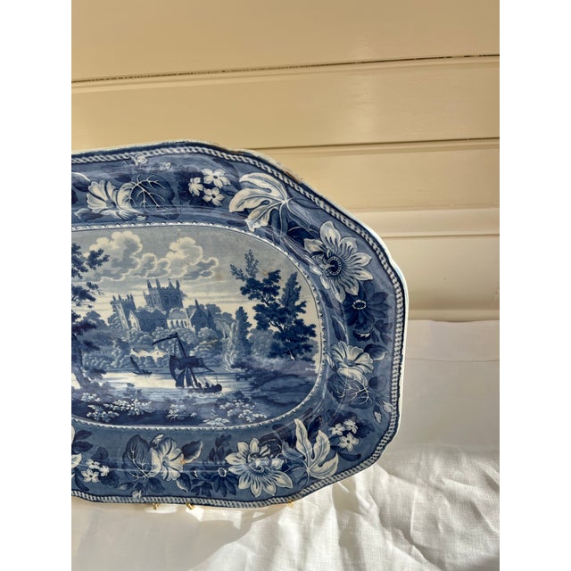 19th-century Staffordshire transfer-printed ceramic platter featuring a blue and white British view scene, in the "Rippon"...