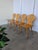Set of 4 vintage wooden dining chairs in Tyrolean style. The chairs feature solid wooden construction with bobbin-turned...