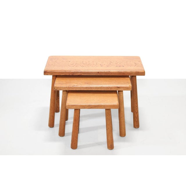 Beautiful set of three solid oak tables. This brutalist set can be conveniently pushed among each other so they don't take...