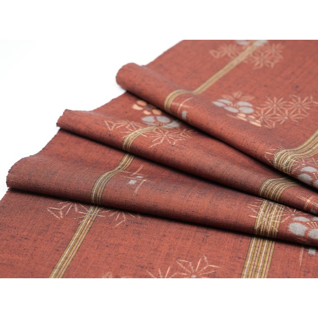 The rust-red of ancient Japan. Woven into your table, once. The Bengara-Ume is a vintage Japanese silk table runner...