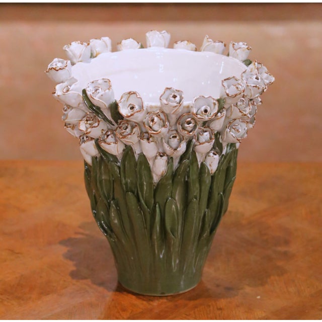 This antique French majolica cachepot from Desvres, crafted circa 1900, presents a richly sculptural jardinière form...