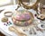 Offering a vintage Chinese Famille Rose porcelain lidded box, Mid 20th Century. This beautiful trinket or jewelry box is...
