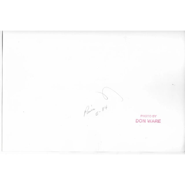 1984 black and white photograph by Los Angeles photographer Don Ware of a sign at the Moulin Rouge cabaret in the Pigalle...