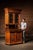 Two-piece Renaissance Revival oak sideboard or china cabinet featuring a projecting molded cornice, turned supports, and...