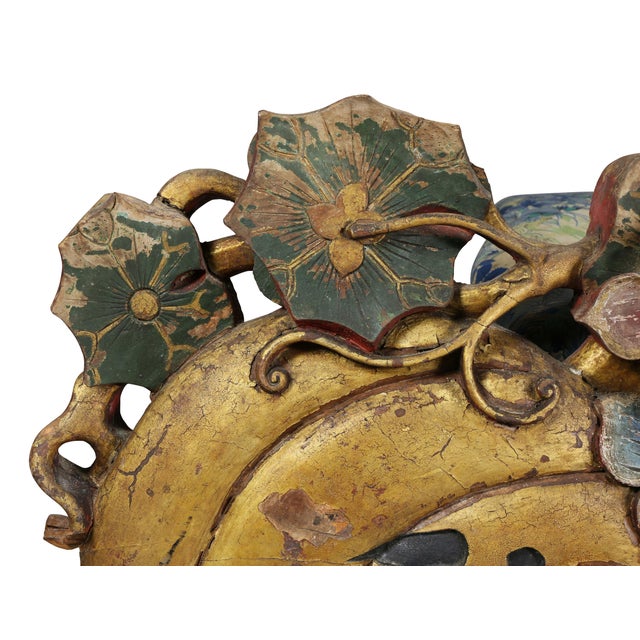 Depicting two large melons with calligraphy surmounted with lotus and flower and dragonfly. Painted in golds, reds, blues...