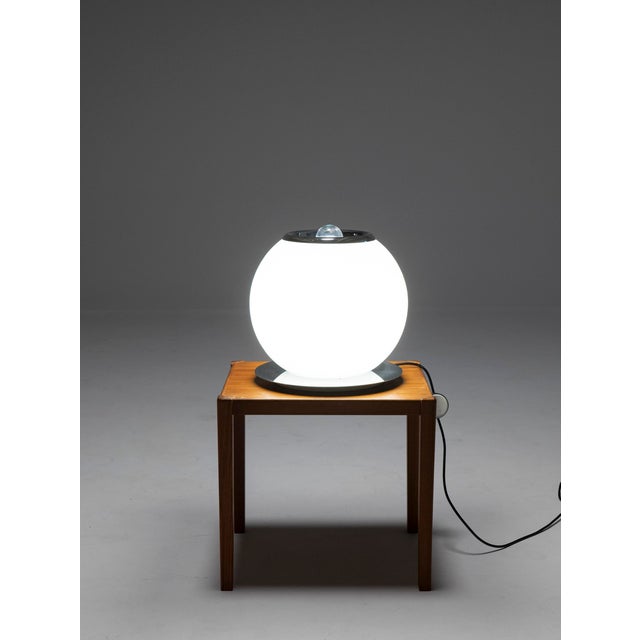 For their next magic trick, Giuliana Gramigna and Sergio Mazza set a large, lit opaline sphere upon a chrome disc, sunk a...