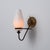 Italian wall sconce dating from the 1950s, characterized by a refined and decorative mid-century composition. The fixture...