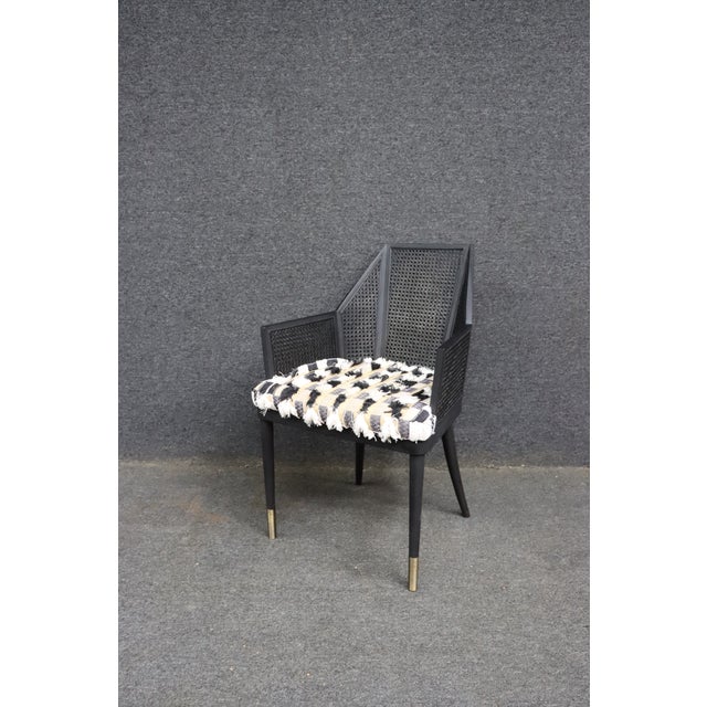 Baker Milling Road dining armchair designed by Kara Mann. This striking chair features an angular black wood frame with...