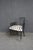 Baker Milling Road dining armchair designed by Kara Mann. This striking chair features an angular black wood frame with...