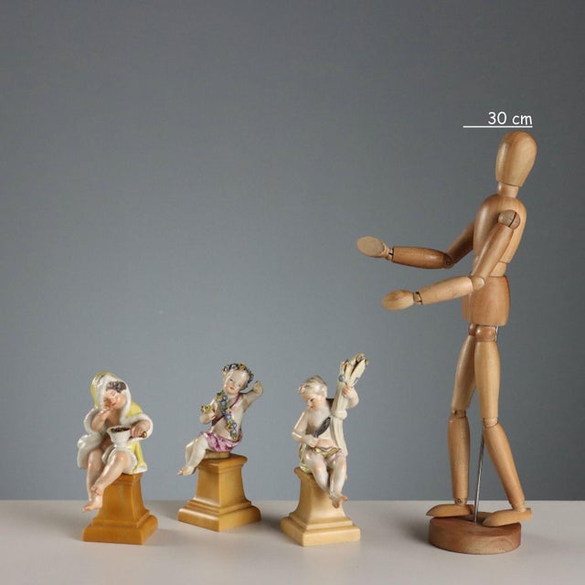 German porcelain figurines depicting allegories of the seasons. The style and workmanship are attributable to the Meissen...