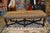 This is a great looking bench / ottoman with a cheetah print cowhide top. Medium, soft seating. Nail head trim & a carved...