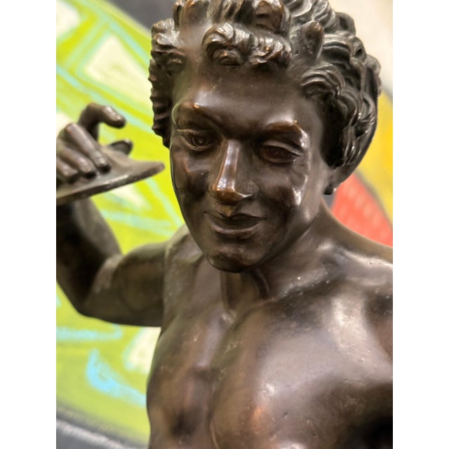 A beautifully cast Grand Tour Neo Classical Bronze of a Dancing Faun or Satyr holding cymbals. The sculpture has wonderful...