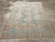 A vintage Persian Afshar accent rug. A pole medallion of three conjoint hooked straw diamonds centers the light blue-grey...