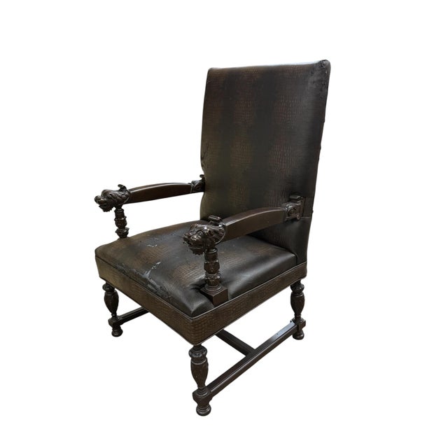 Renaissance-style armchairs featuring carved walnut wood and lion head armrests. Renaissance Revival, characterized by...