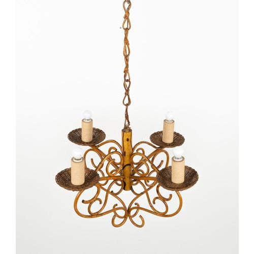 Midcentury amazing chandelier pendant in bamboo, rattan and wicker featuring four lights. Made in Italy in the 1960s...