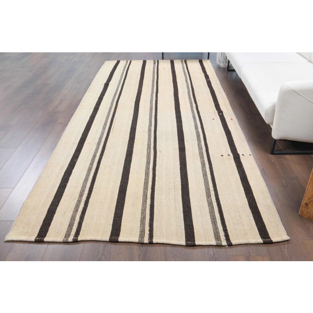 Vintage Turkish Hand-Knotted vintage rug is a semi-antique vintage kilim rug.'70s Eastern region of Turkey's unique rug is...