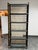 Design Plus Gallery presents a Mid 20th Century Black Bamboo Étagère with Wicker + Glass. The étagère takes on organic...
