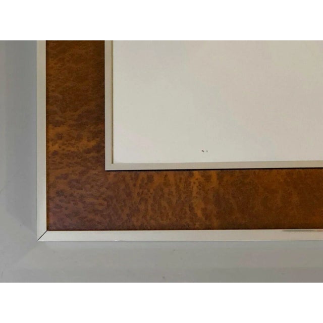 A luxurious rectangular wall mirror, post-modernist, shabby-chic, with a frame decorated with a glowing leather loupe...