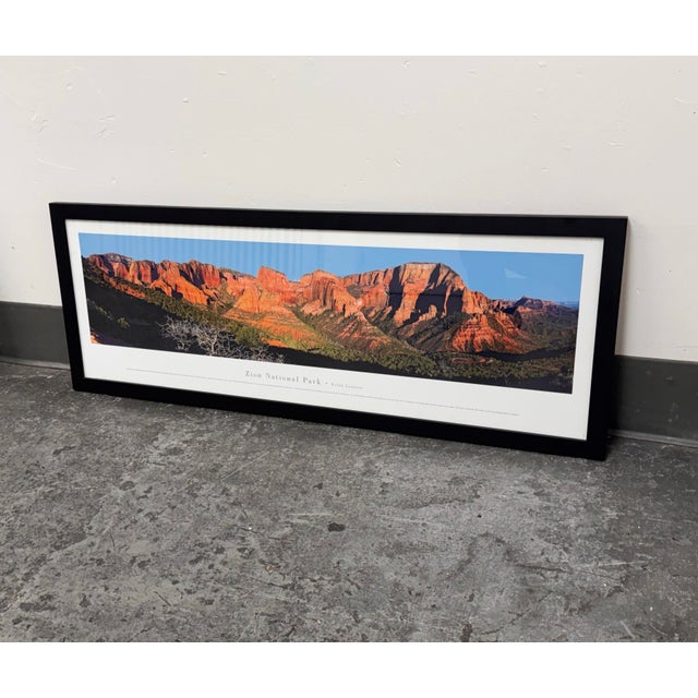 Design Plus Gallery presents a framed panoramic print of Zion National Park, Kolob Canyons. The composition captures red...
