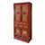 Red lacquered cabinet with gilt carved panels depicting animals and foliage, set on a low openwork stand. Upper cabinet,...