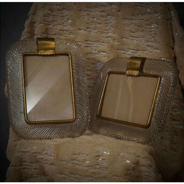 Splendid Murano frame by Barovier & Toso Murano, in brass and clear glass. Refinement and class, typical of Murano style,...