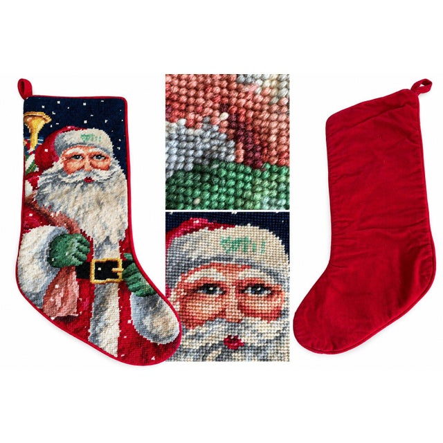 A charming vintage-style Christmas stocking featuring a beautifully detailed needlepoint design of Santa Claus. The...