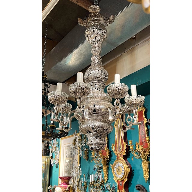 Great quality Baroque Revival Silvered Metal Chandelier with eight electrified candles and molded glass drip pans . With...