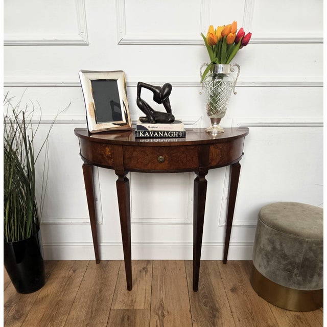 Very elegant and refined Italian Mid-Century Modern design demi lune console side table. Standing on four typically shaped...