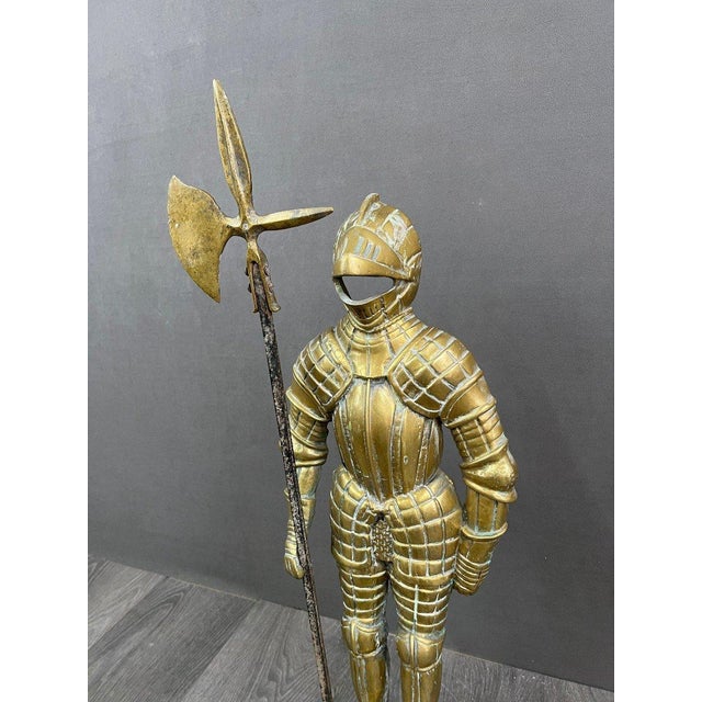We present this imposing statue of an armored warrior, a noble replica of a medieval knight wielding a halberd. This...