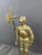 We present this imposing statue of an armored warrior, a noble replica of a medieval knight wielding a halberd. This...