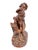 Charming mid-century French sculptural piece depicting a classical putto figure playfully grappling with a goat. This...