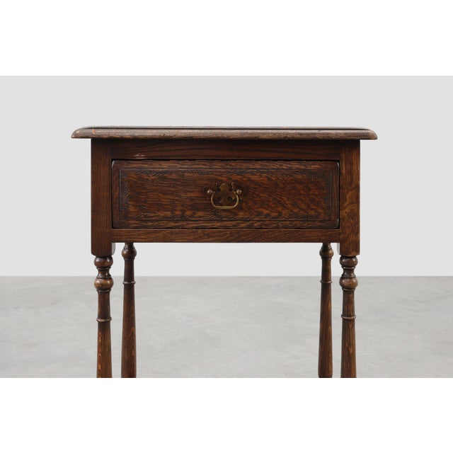 A charming 19th‑century French rustic cabinet crafted in solid oak, ideal as a small side cabinet or nightstand. This...
